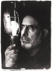 Mahmood Rezaei-Kamalabad at Aladdin Auto, where he is both owner and seer. 'All my thinking,' he says, 'is 'unite, unite, unite.''
